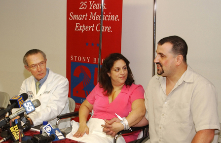Dr. Frank C. Seifert (left) with Roseann Errante and her husband, Joseph, at news conference following her successful emergency heart surgery hailed as a medical miracle.