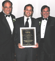 Dr. Daniel N. Rutigliano (center) receiving award from Dr. John J. Ricotta (left) and Dr. Marc J. Shapiro (right).