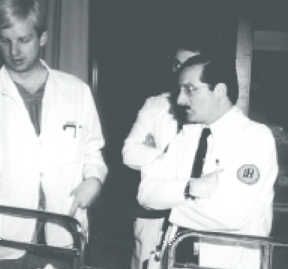 Dr. David J. Kreis, Jr., (right) rounding with residents.