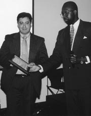 Dr. Steve Martinez (left) receiving award from Dr. Collin E.M. Brathwaite.